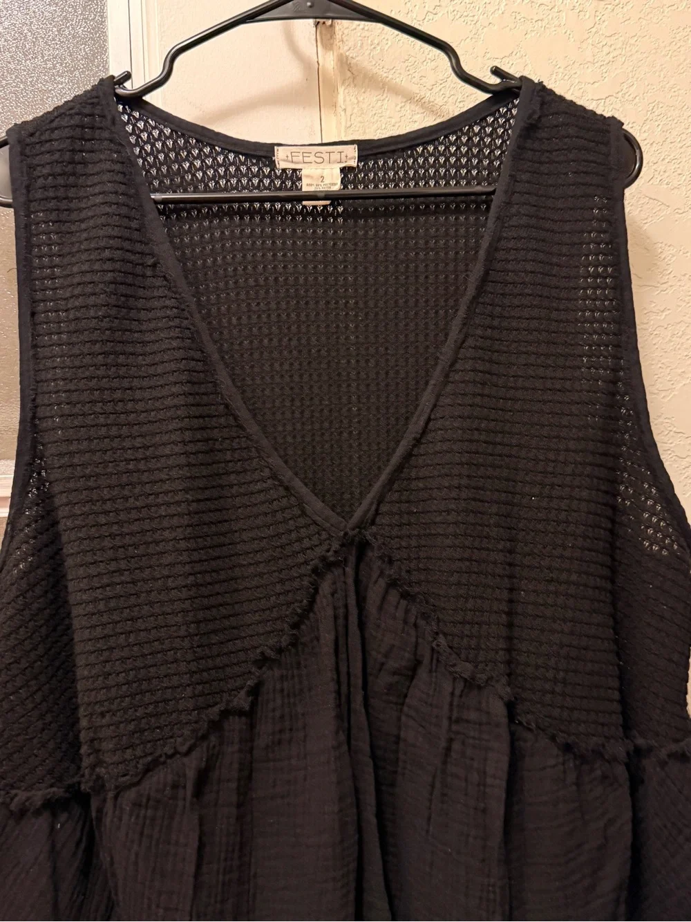Torrid distressed jeans shorts with black flowy tank -